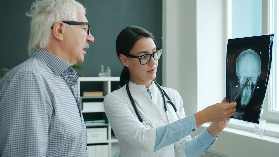 Health Claims and Spa Advertising: Regulatory Compliance in Marketing Doctor shows x-ray scan to an elderly patient.