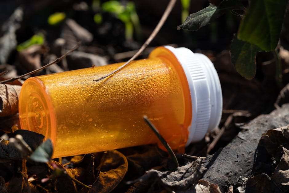 Water Management in Thermal Resorts: Conservation and Recycling Strategies close up of an empty orange pill bottle lying on the ground
